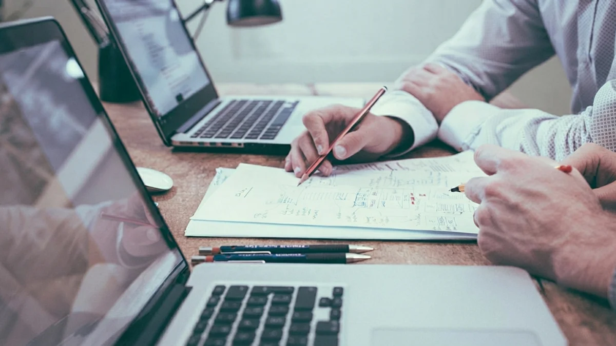 Business planning documents and laptop