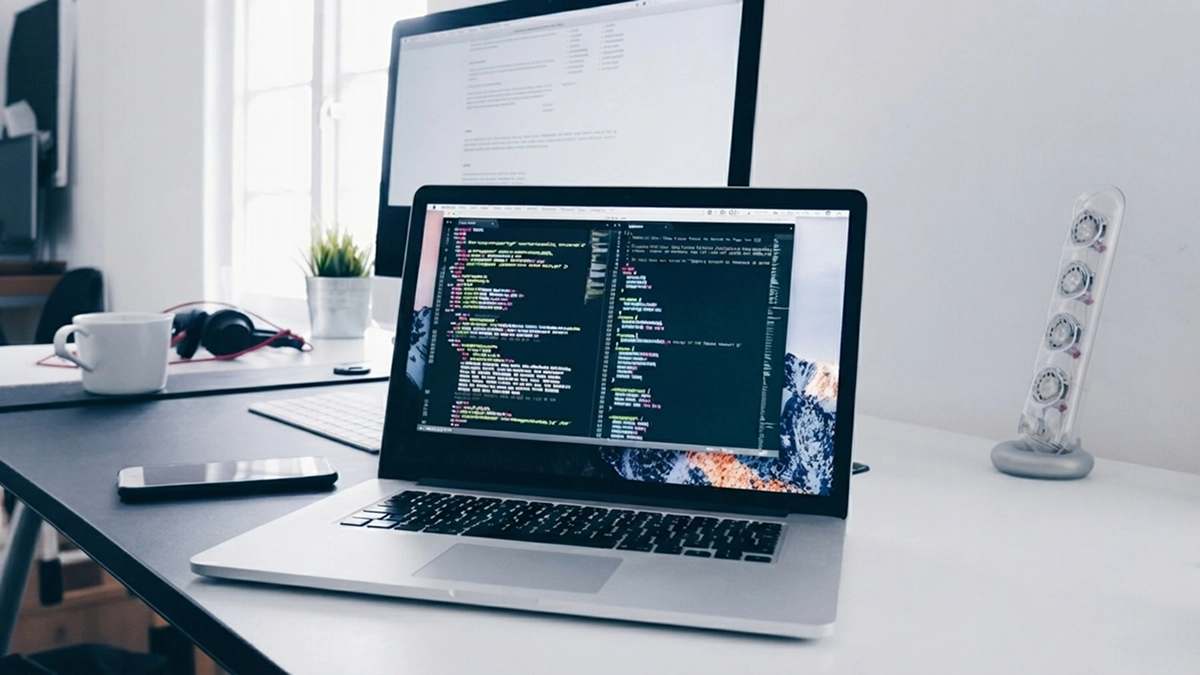 Developer workspace with code on screen